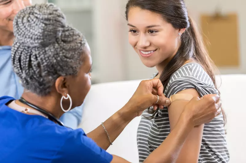 A woman receiving a vaccination 
