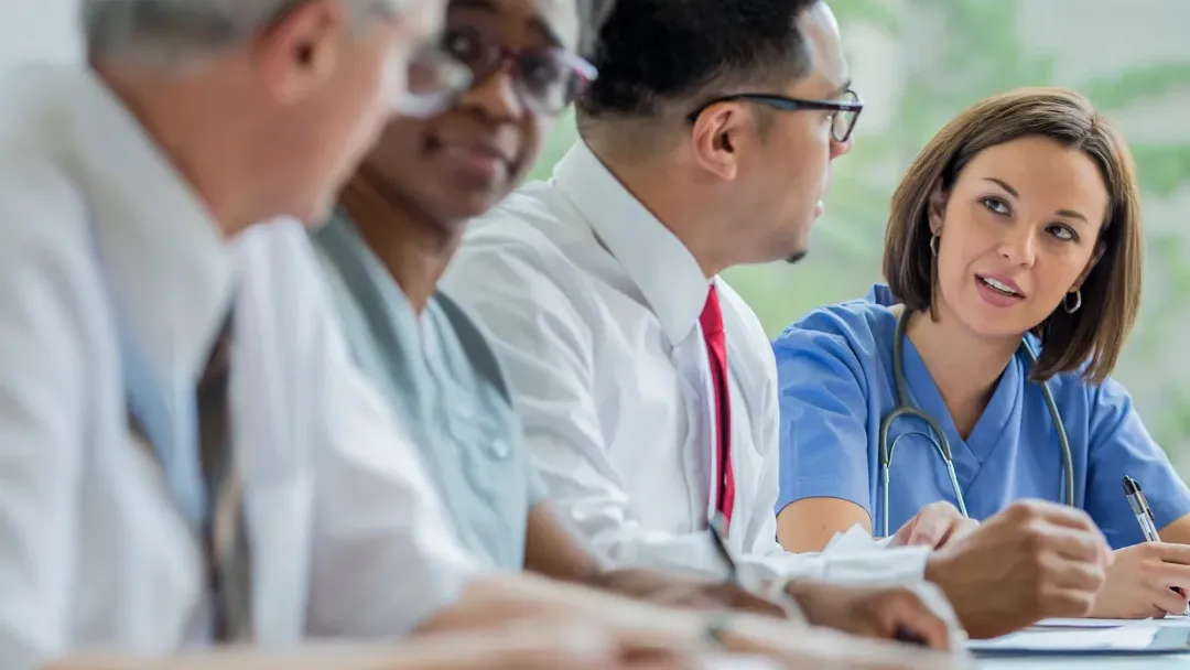 A Resident speaks with Hospital Staff
