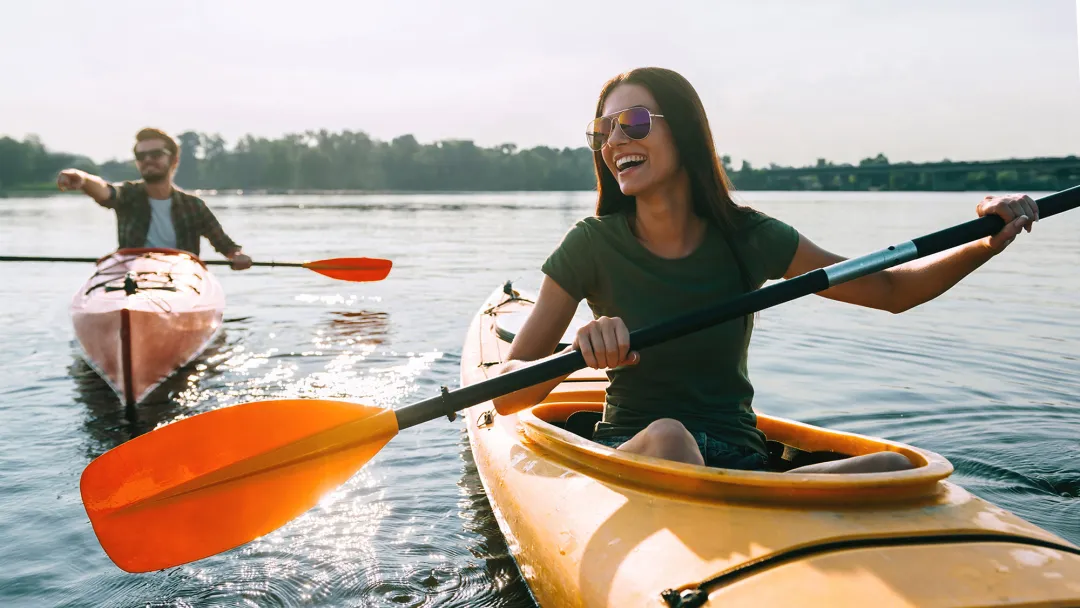 Happy Couple Kayaking on a lake
