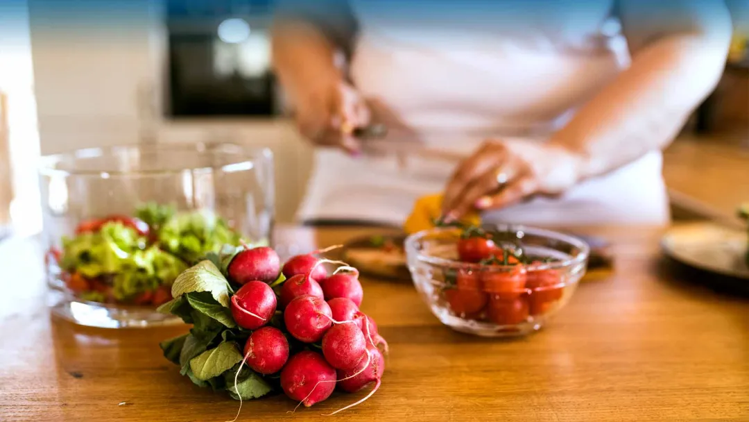 Woman chopping vegetables