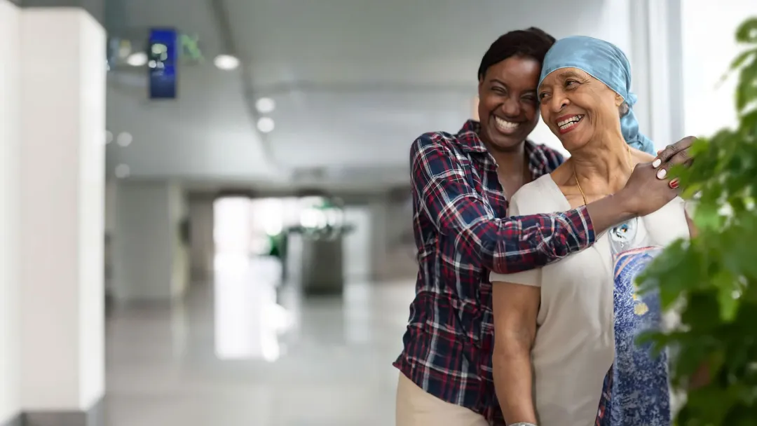 Cancer mom and daughter hugging