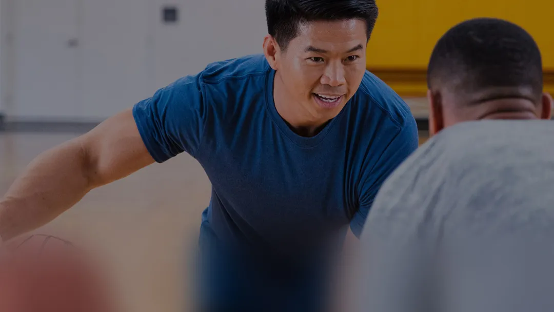 two men playing basketball