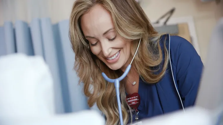 Woman who works for AdventHealth smiling.