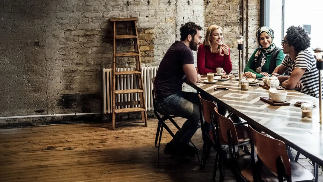Young Adults at a Coffee Shop Chatting