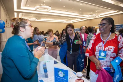 Women attending the Women’s Health and Cancer Prevention Event visiting the table demonstrations.