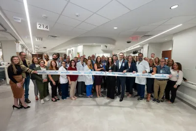 Group of people at the ribbon cutting of Wesley Chapel.