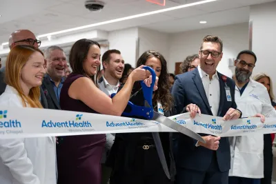 Group of people at the ribbon cutting of Wesley Chapel.