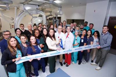 Group of people at the ribbon cutting of Wesley Chapel.