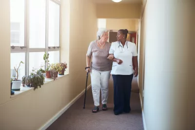 Physician walking with elderly patient
