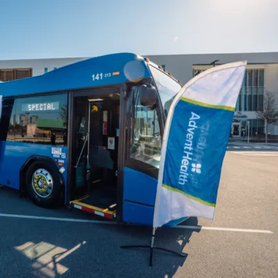 A newly AED-equipped LYNX LYMMO bus at an AdventHealth press event with the American Heart Association.