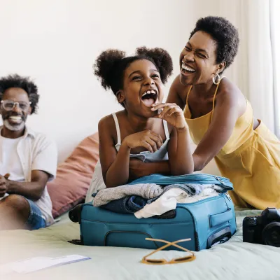 A family having fun while packing luggage