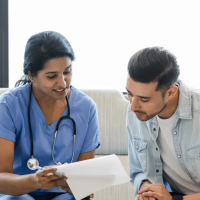 A Doctor Goes Over a Chart with her Patient