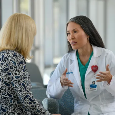 Doctor speaking with patient giving expert advice