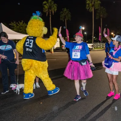 Swish giving out a high 5 at Pink on Parade