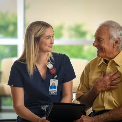a nurse talks to a patient