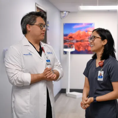 A doctor and staff speaking