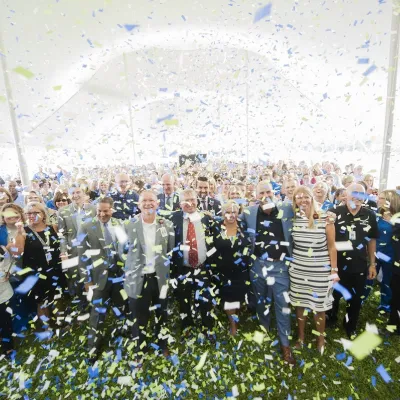 Confetti raining down on group of people.