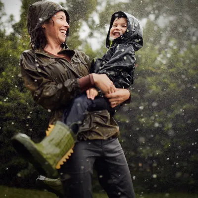 Mom and Child Under a Sprinkler 