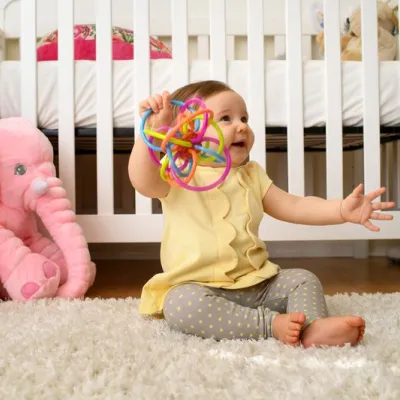 Baby plays with her toy at home