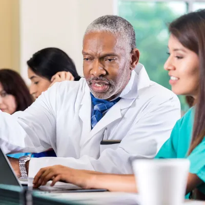 Physicians learning in a classroom.
