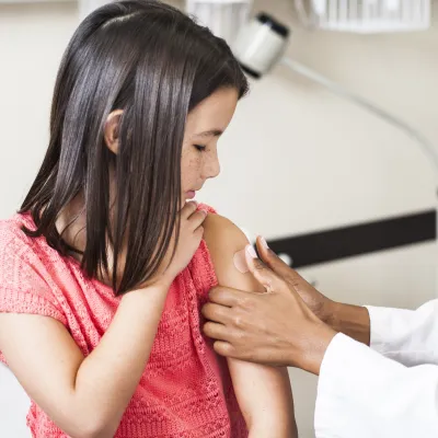 Little girl getting a shot