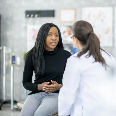 Millennial woman with primary care doctor