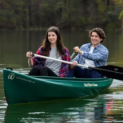 Couple having a quiet journey in a canoe.