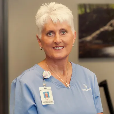 A headshot of a white elderly female.