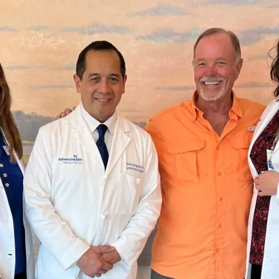 Warren Meyer, 70, said having a low-dose CT scan of his lungs at AdventHealth changed his life. The scan revealed a small nodule that was determined to be cancerous. The nodule was successfully removed while the cancer was still small and contained. From left to right: Sandra Jennings, director of oncology support and education; Dr. Patrick Mangonon, cardiothoracic surgeon; Warren Meyer, patient; and Jennifer Bottke, advanced practice registered nurse, cardiothoracic surgery. 