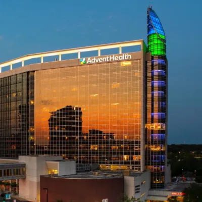 AdventHealth Orlando exterior in the evening.