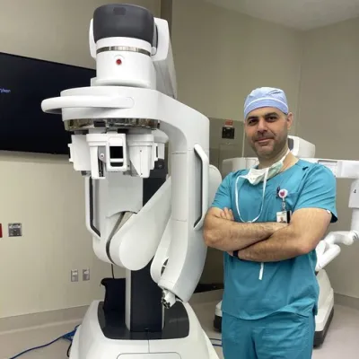 Dr. Allawi with daVinci robot