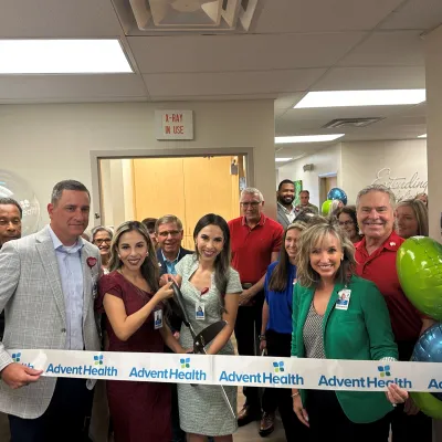 AdventHealth leaders and team members cut the ribbon at the new office in Lake Wales, with the support of community leaders and members
