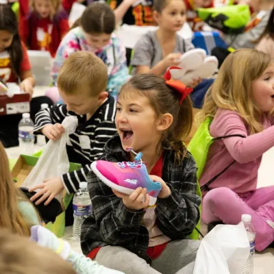 Little girls with a new pair of shoes.