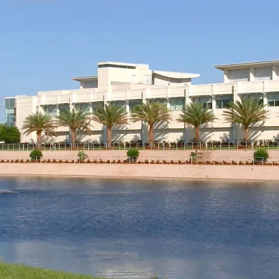 AdventHealth Sebring building, viewed from across a lake