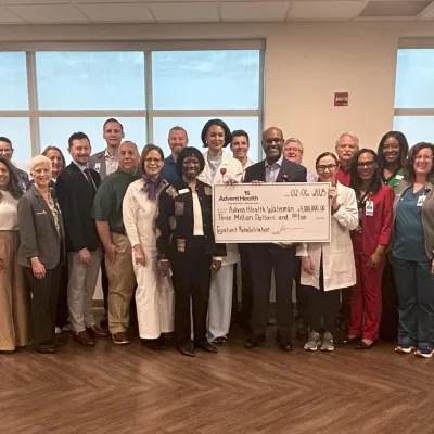AdventHealth Waterman team members gather for the check presentation.