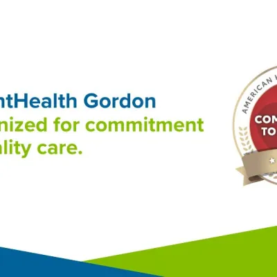A red and gold badge that reads "American Heart Association: Commitment to Quality 2025"