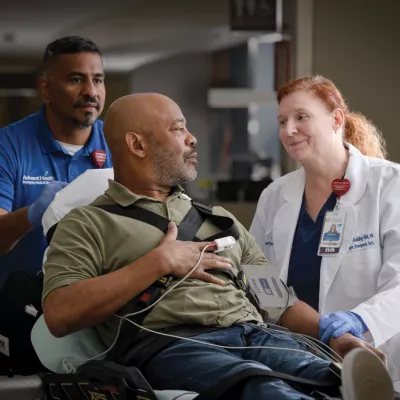 Patient with doctor going into in Emergency Room.