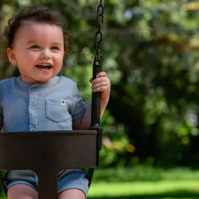 A toddler on a swing