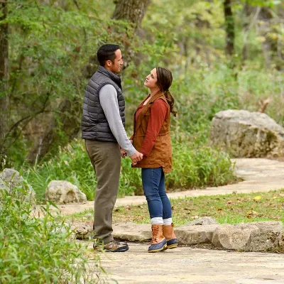 A couple having a serious talk while gazing into each other's eyes outdoors