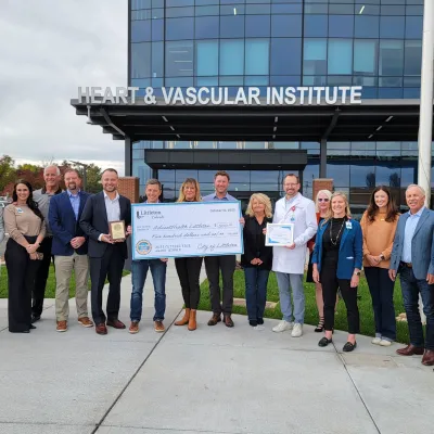 City of Littleton and AdventHealth Littleton representatives pose with award