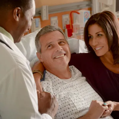 Physician with and Patient and family