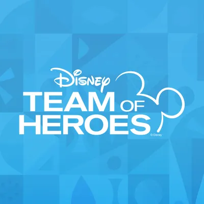 Disney Team of Heroes logo on a blue It's a Small World themed background.