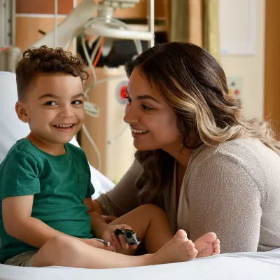 a child and his mother in the hospital