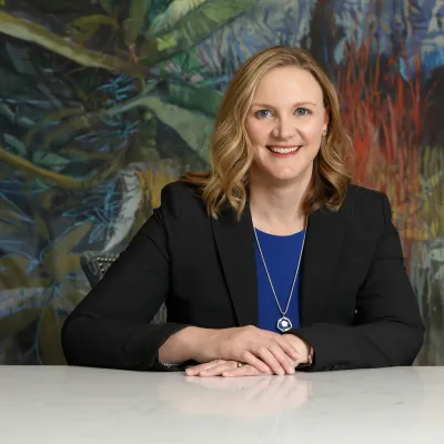 Dr. Lisa Hays sitting with arms crossed