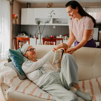 Mother and daughter relaxing together in the living room