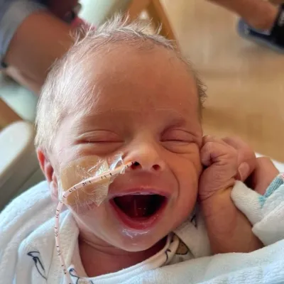 Baby Archer Hanson smiles at the camera from the NICU at AdventHealth Celebration.