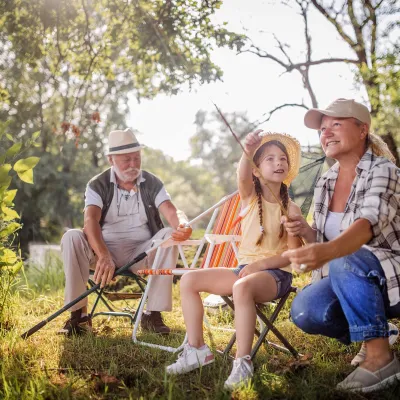 Grandparents getting ready to fish with their granddaughter