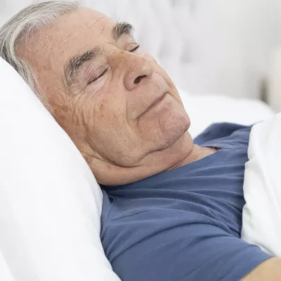 A man sleeps soundly.