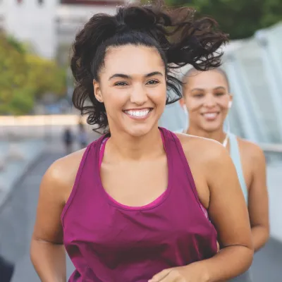 Two women running.