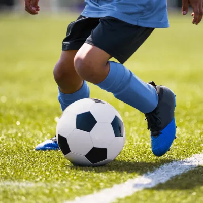 A young player at a soccer practice. 